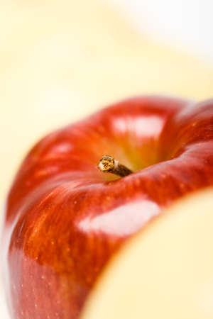 one closeup red apple with yellow backgoundsの写真素材