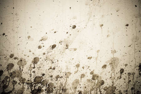 sepia toned grunge spotted wallの写真素材