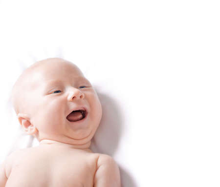 cute baby boy smiling on white background, copy space for the textの写真素材