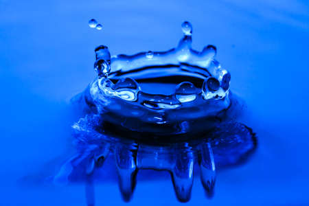 blue water splash crown wallpaperの写真素材