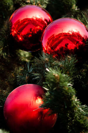 closeup three big red christmas ballsの写真素材