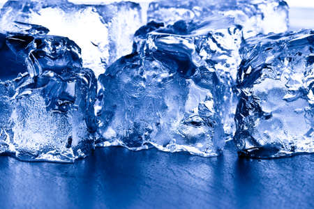 closeup ice cubes , blue toned backgroundの写真素材
