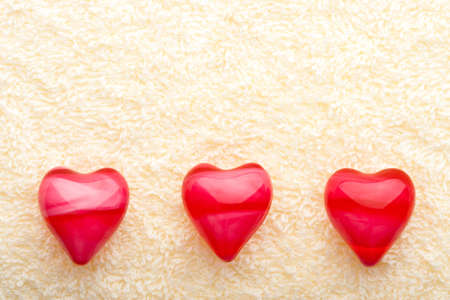 three oil hearts on yellow towel, copy space fo the textの写真素材