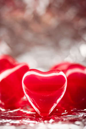 red hearts with foil background, copy space for the textの写真素材