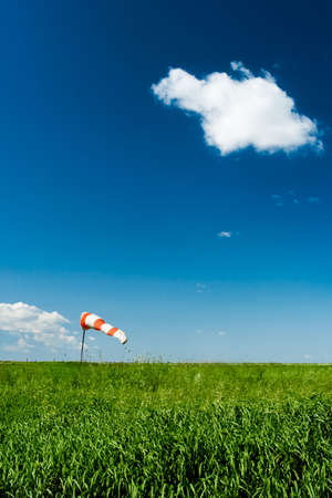 windsock on green filed under blue skiesの写真素材