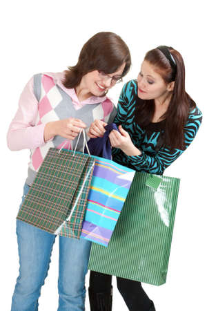 two ladies in shopping process isolated on whiteの写真素材