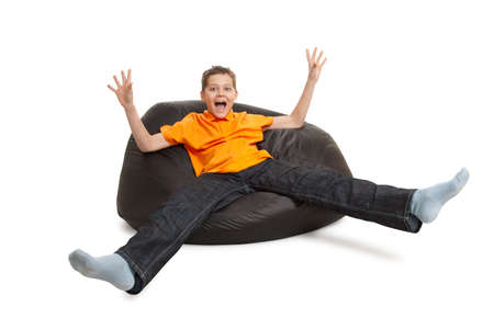 young man on bean bag isolated on whiteの写真素材