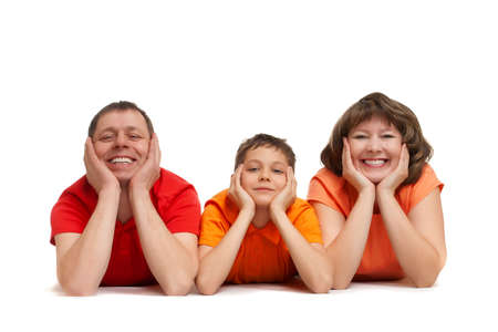 family laying on the floor isolated on whiteの写真素材
