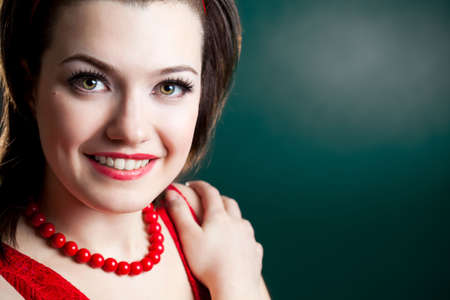 closeup woman face portrait over greenの写真素材