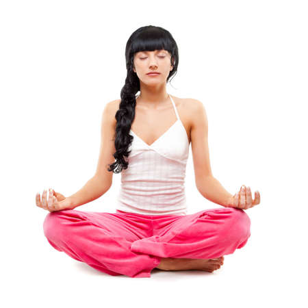 woman meditating in lotus pose over whiteの写真素材