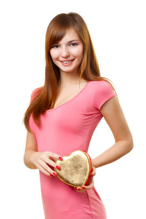 woman holding heart shape box over whiteの写真素材