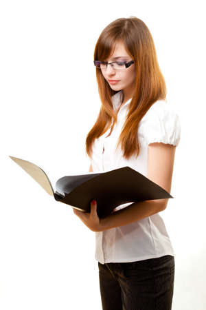 businesswoman reading documents over whiteの写真素材