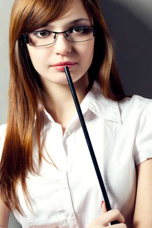 beautiful woman closeup portrait with pointer wandの写真素材