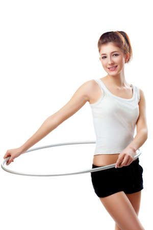 young woman with hoop over whiteの写真素材