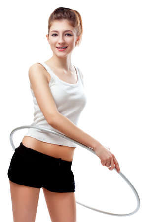 young woman with hoop over whiteの写真素材