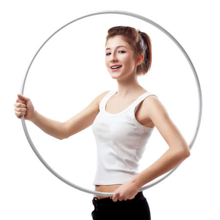 young woman with hoop over whiteの写真素材