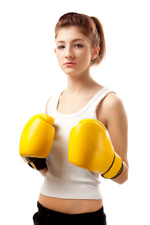 young woman wearing yellow boxer glovesの写真素材
