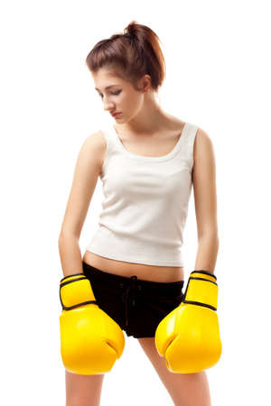 young woman wearing yellow boxer glovesの写真素材