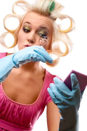 housewife portrait wearing blue gloves over whiteの写真素材