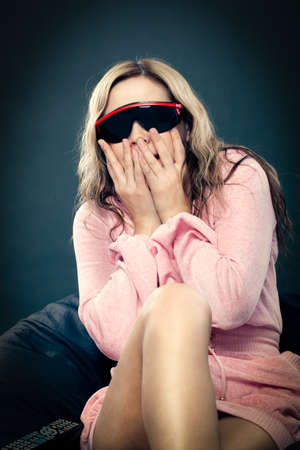 woman wearing 3d glasses at homeの写真素材