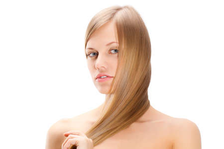 portrait of beautiful  woman with long straight blond hair over whiteの写真素材
