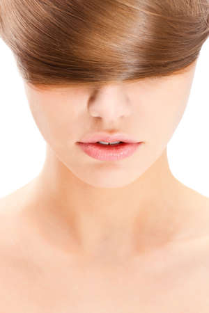 closeup portrait of beautiful  woman with long straight blond hair coiled on headの写真素材