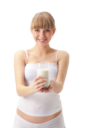 pregnant woman with milk  over whiteの写真素材