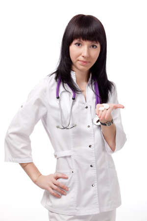 beautiful woman doctor with phonendoscope over whiteの写真素材