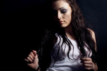 beautiful wet sexy woman portrait near black wallの写真素材