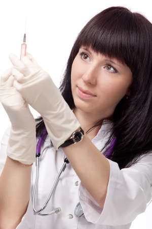 woman doctor portrait with syringe over whiteの写真素材