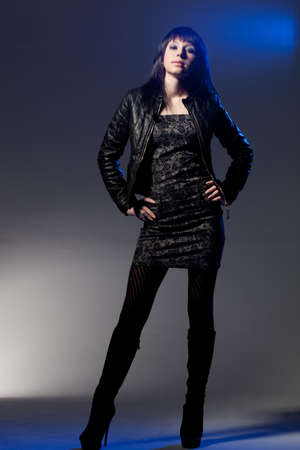woman wearing leather jacket dark style portraitの写真素材