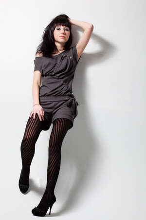 woman wearing gray costume over whiteの写真素材