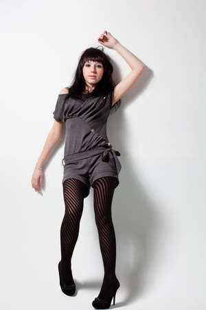 woman wearing gray costume over whiteの写真素材