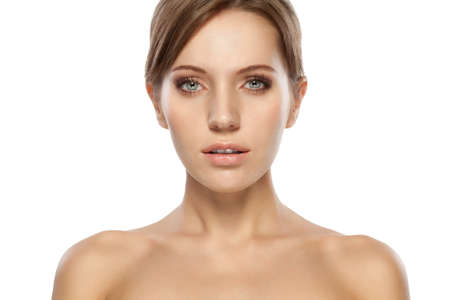 beautiful woman face and shoulders over whiteの写真素材