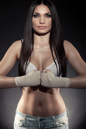 beautiful woman boxer portrait wearing bandage on hands の写真素材