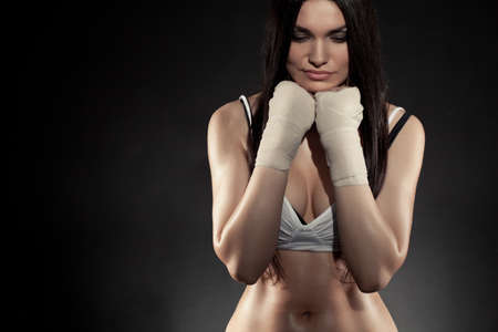 beautiful woman boxer portrait wearing bandage on hands の写真素材