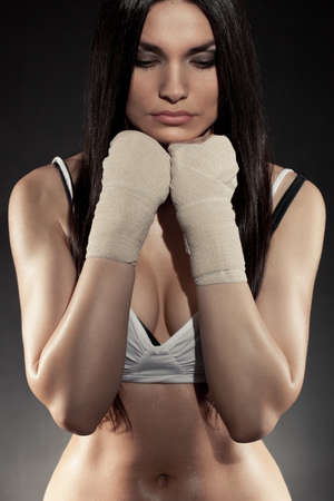 beautiful woman boxer portrait wearing bandage on hands の写真素材