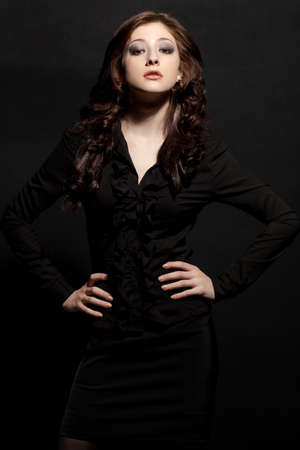woman fashion model posing over blackの写真素材