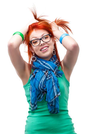 red haired girl with hands on head over whiteの写真素材