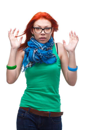 red-haired girl portrait over white in fearの写真素材