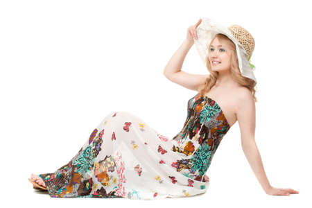 blond pretty woman posing wearing summer dress over white studio portraitの写真素材