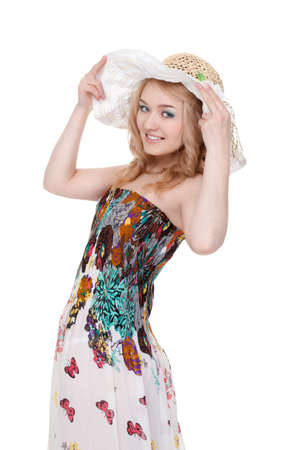 blond pretty woman posing wearing summer dress over white studio portraitの写真素材