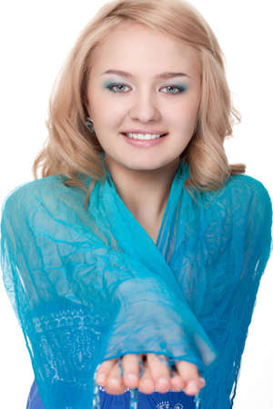blond pretty woman posing wearing blue dress over white studio portraitの写真素材