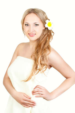 beautiful blond woman wearing towel , spa style over whiteの写真素材