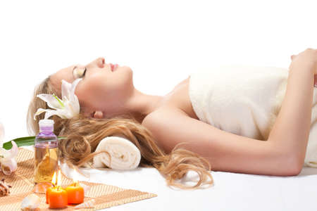 woman taking over spa treatment over whiteの写真素材