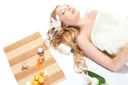 woman taking over spa treatment over whiteの写真素材