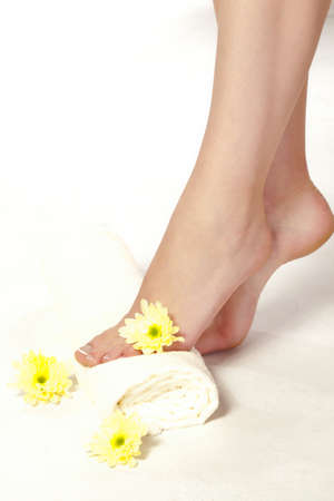 woman feet standing on towel, spa styleの写真素材