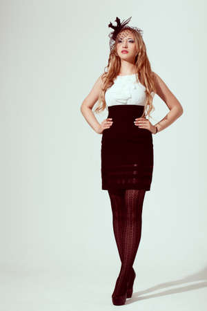 woman wearing retro syled dress,  studio shotの写真素材