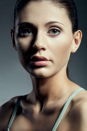 beautiful woman closeup portrait over gradient backgroundの写真素材