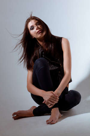 beautiful woman rock style fashion studio portraitの写真素材